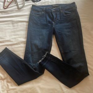 Stretch skinny jeans jeans with cut off bottoms.